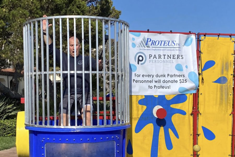 Mark McComb, President of Partners Personnel, getting dunked in the Proteus Dunk Tank