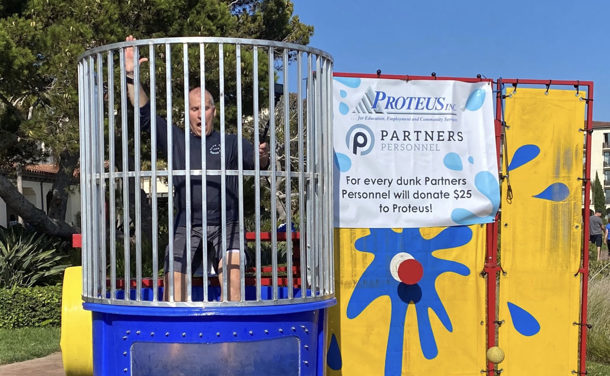 Mark McComb, President of Partners Personnel, getting dunked in the Proteus Dunk Tank